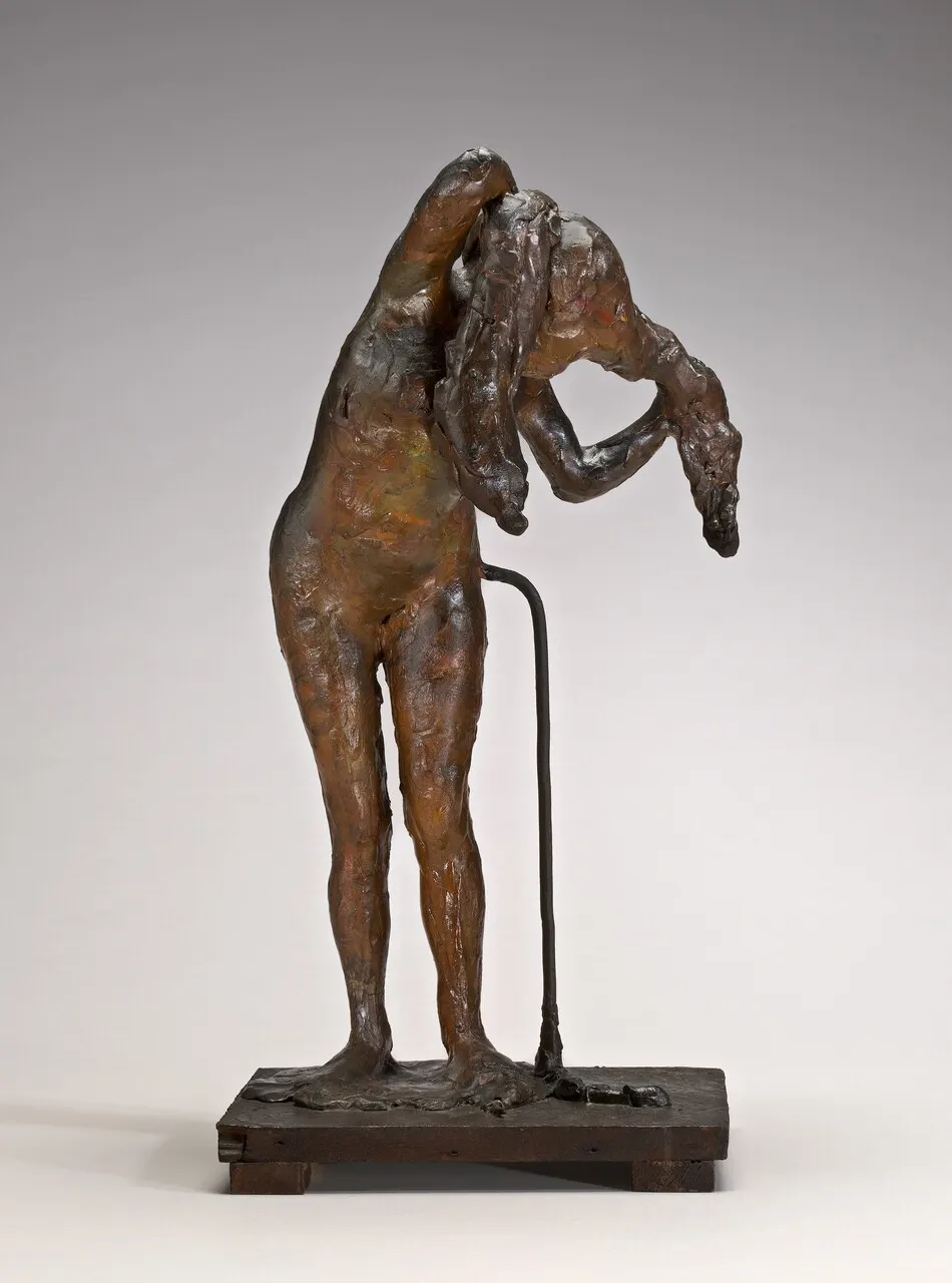Woman Arranging Her Hair by Edgar Degas