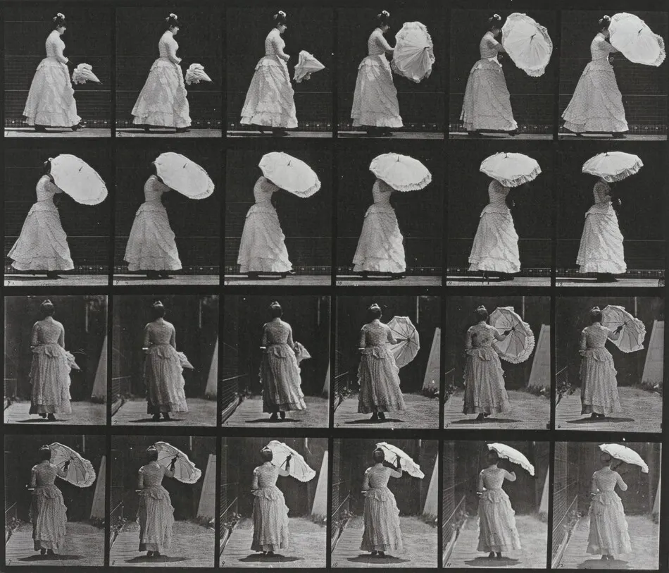 Plate Number 38. Walking and opening a parasol by Eadweard Muybridge