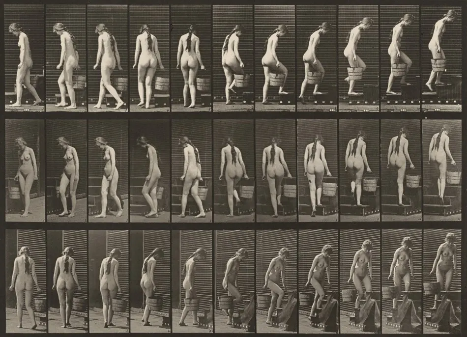 Plate Number 102. Turning and ascending stairs with a bucket of water in right hand by Eadweard Muybridge