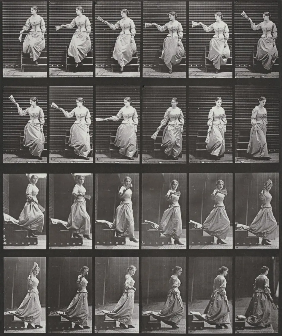 Plate Number 140. Descending stairs, looking around and waving a fan by Eadweard Muybridge