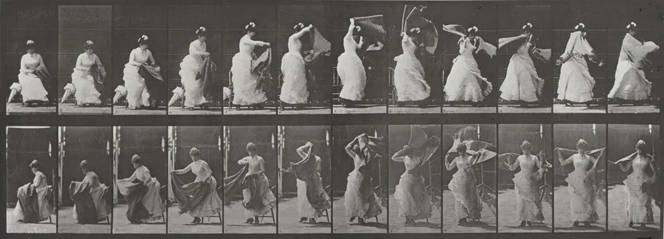 Plate Number 424. Toilet, rising from chair and putting on shawl by Eadweard Muybridge