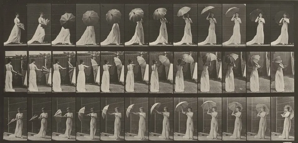 Plate Number 461. Opening a parasol and turning around by Eadweard Muybridge