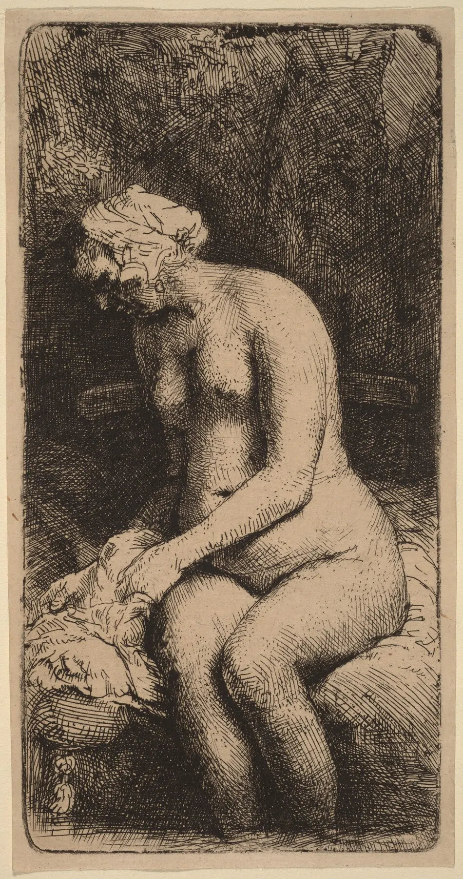 Nude Seated on a Bench with a Pillow (Woman Bathing Her Feet at a Brook) by Rembrandt van Rijn