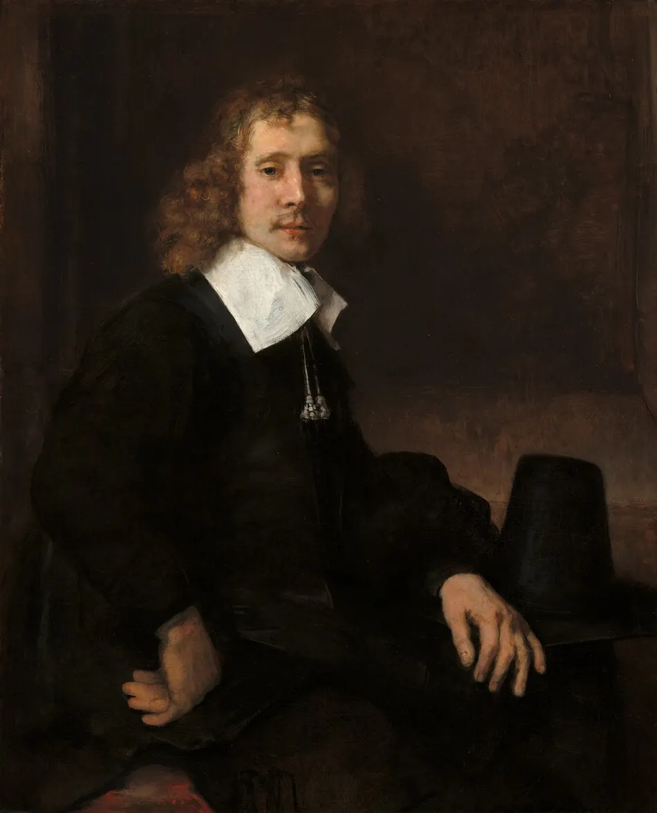 A Young Man Seated at a Table (possibly Govaert Flinck) by Rembrandt van Rijn